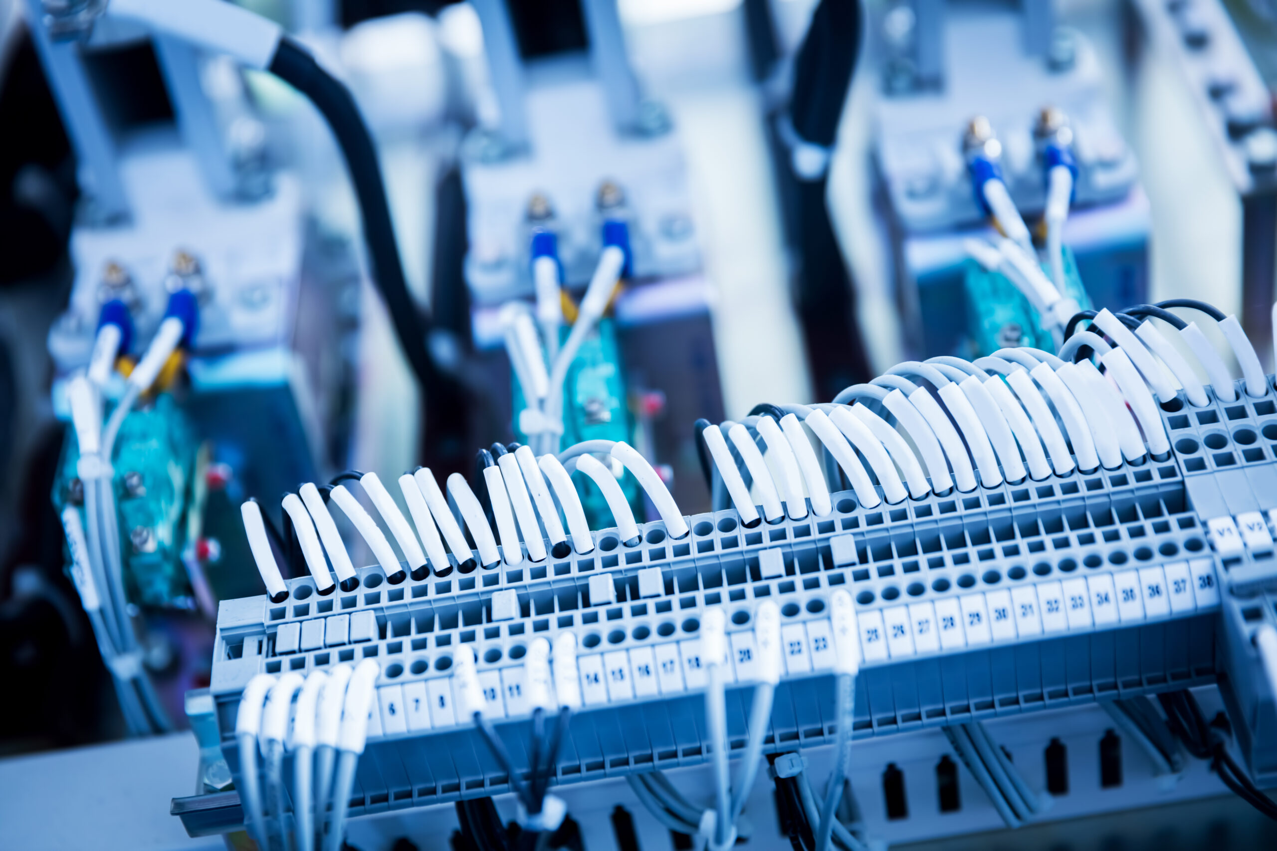 Electric wires attached to a long device. Industrial close-up shot. Railway industry